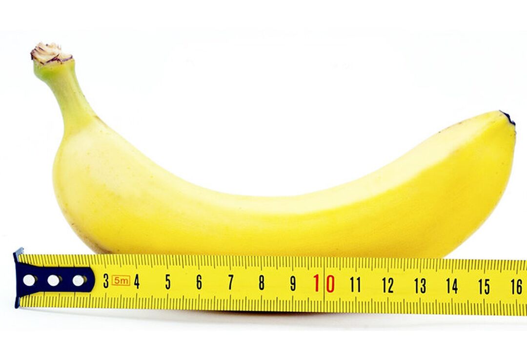 een banaan met een liniaal symboliseert het meten van de penis na de operatie